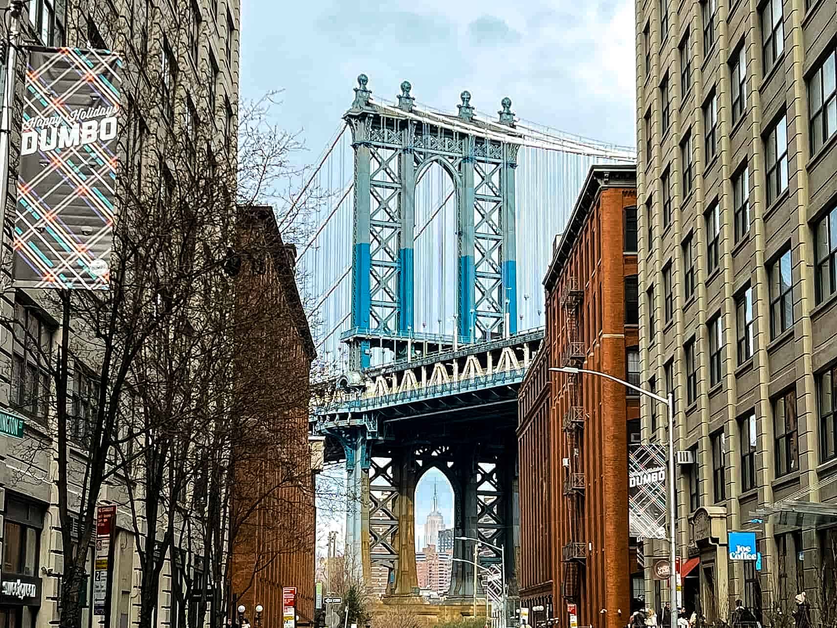 Manhattan Bridge with a view of the Empire State Building in Dumbo - New York City, USA.