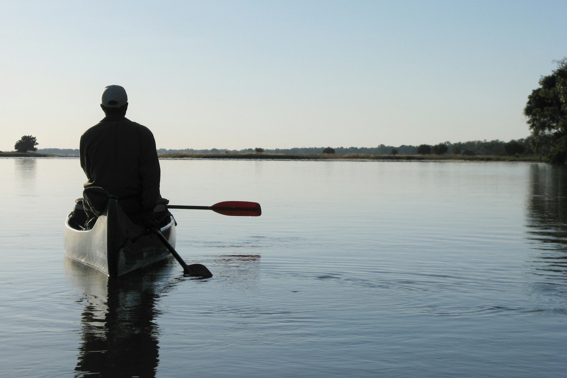 Person on a canoe in the Zambezi River, Zambia