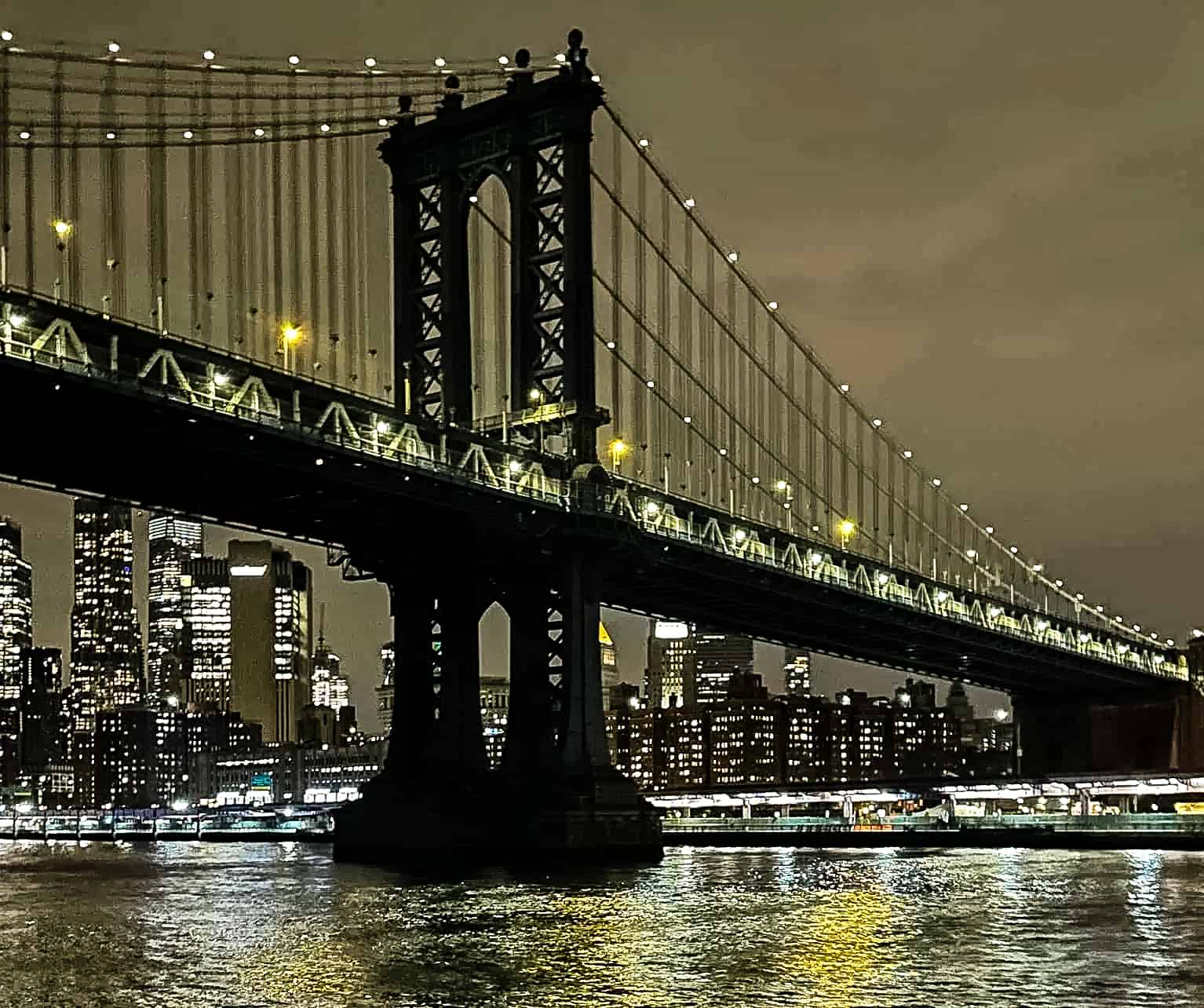 The Brooklyn Bridge from the water - New York City, USA
