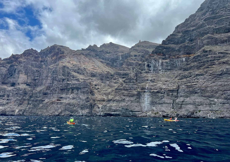 Sea kayaking around the Los Gigantes cliffs in Tenerife, Spain.
