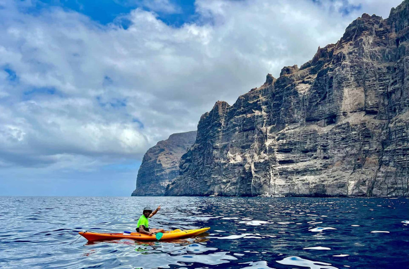 Sea kayaking around the Los Gigantes cliffs in Tenerife, Spain.